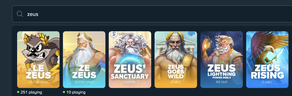 Stake.us Zeus slots page showcasing popular Zeus-themed games including Le Zeus, Ze Zeus, Zeus' Sanctuary, Zeus Goes Wild, Zeus Lightning Power Reels, and Zeus Rising, with live player counts displayed.