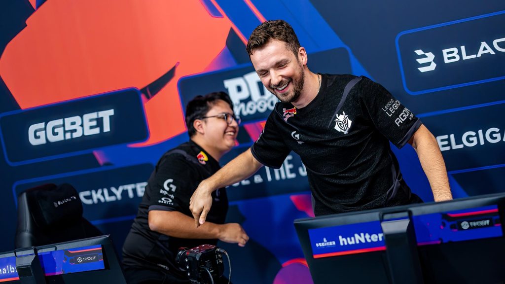 G2 players huNter- and malbsMd celebrating a victory at a BLAST CS2 event.