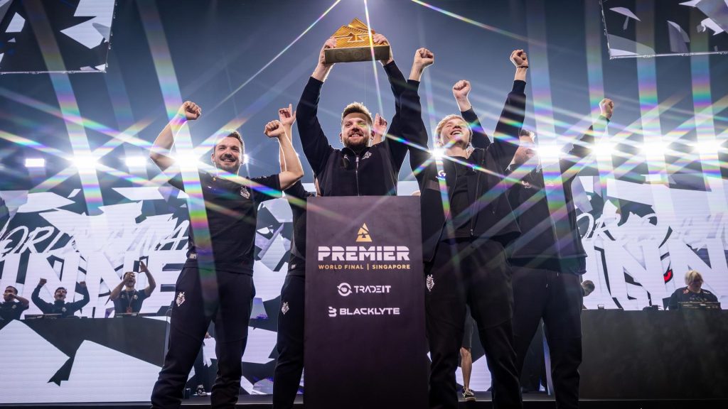 G2 Esports lift trophy at Counter-Strike 2 tournament BLAST World FInal.