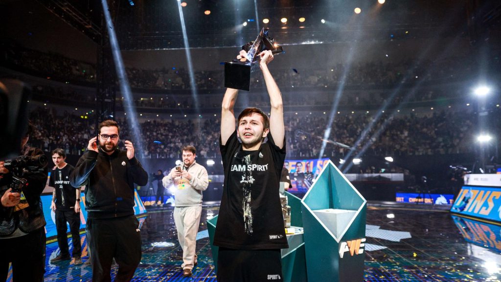 Team Spirit's sh1ro lifts the Perfect World Shanghai CS2 Major trophy on stage.