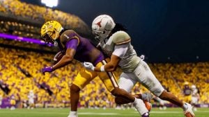 A player in College Football 26 being tackled.