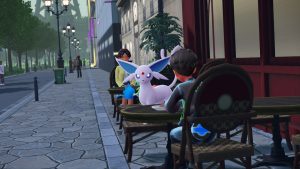 Espeon at a cafe alongside a player in Pokémon Legends: Z-A
