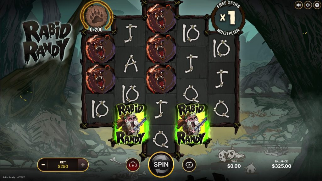 Rabid Randy slot shows its cartoon wilderness theme with snarling bear symbols and glowing character icons across its dark, bone-framed reels.