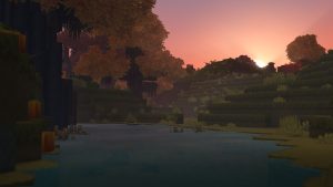 The sun setting over an autumn forest biome in Hytale